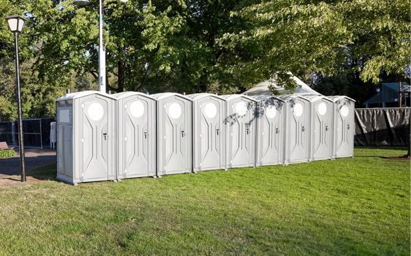 ADA compliant portable toilet at an outdoor event