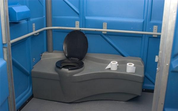 Accessible portable restroom with grab bars